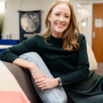 Brandie Nonnecke, Co-Director, UC Berkeley Tech Policy Fellowship. Brandie has red hair and is wearing a dark green sweater.